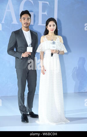 Chinese actress Yang Mi, right, and Taiwanese actor and model Ethan Juan attend a promotional event for PIAGET in Beijing, China, 11 May 2018. Stock Photo