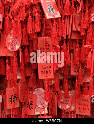 Blessings written by Chinese parents to prayer their children for good luck in the upcoming national college entrance exam, also known as gaokao, are Stock Photo