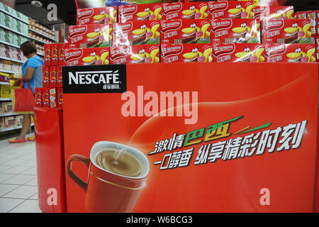 --FILE--Cartons of Nescafe instant coffee of Nestle are for sale at a supermarket in Xuchang city, central China's Henan province, 29 June 2014.    Sw Stock Photo