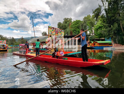 Xochimilco, Mexico City, June 25, 2019 - Traditional boat sellers on canals of Xochimilco Stock Photo