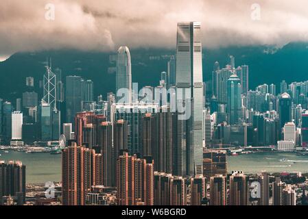 Wide shot of great architecture in an urban city with breathtaking clouds in the background Stock Photo