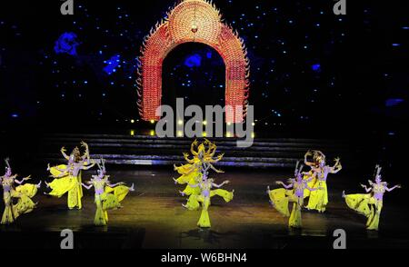 Chinese hearing impaired dancers from China Disabled People's Performing Art Troupe give a charity performance of the Thousand-Hand Guan Yin, the Bodh Stock Photo