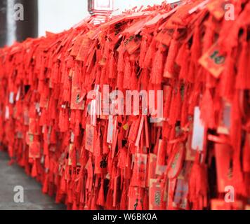 Blessings written by Chinese parents to prayer their children for good luck in the upcoming national college entrance exam, also known as gaokao, are Stock Photo