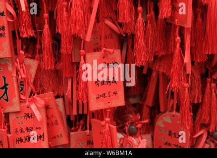 Blessings written by Chinese parents to prayer their children for good luck in the upcoming national college entrance exam, also known as gaokao, are Stock Photo