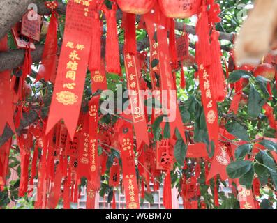 Blessings written by Chinese parents to prayer their children for good luck in the upcoming national college entrance exam, also known as gaokao, are Stock Photo