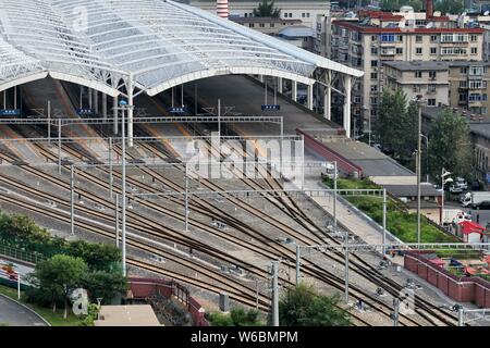 The Dandong Railway Station and residential building of property projects are seen in Dandong city, northeast China's Liaoning province, 23 August 201 Stock Photo