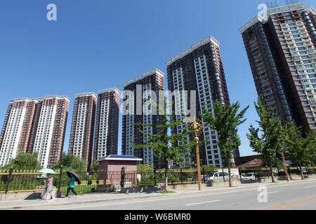 High-rise residential building of property projects are seen in Dandong city, northeast China's Liaoning province, 22 August 2016.   The Chinese city Stock Photo