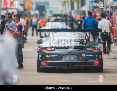 Bang Saen, Thailand - July 1, 2017: The Porsche GT3 Cup of Tanart Sathienthirakhul from Thailand driving down the busy pit lane during Porsche Carrera Stock Photo