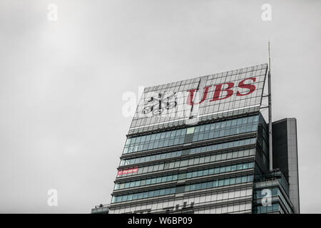 --FILE--A logo of Swiss bank UBS Group is pictured on an office building in Shanghai, China, 6 November 2017.    China's top securities regulator has Stock Photo