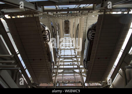 Cars are parked in a 26-storey parking garage with automated parking ...