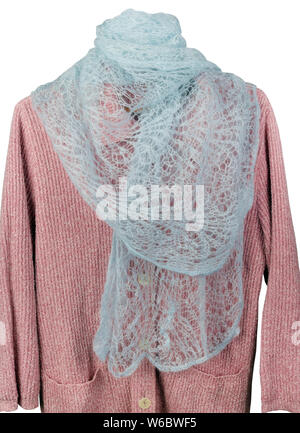 Homemade knitted warm woolen women's  gray scarf hanging on a pink sweater.  Rustic elderly people style handcraft  concept Stock Photo