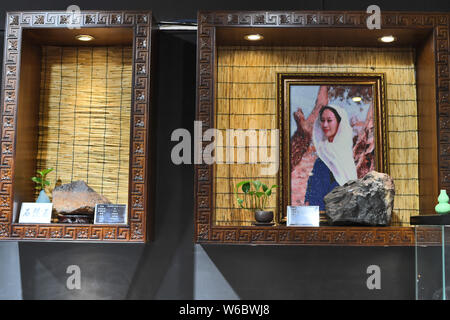 The artworks made of aerolite are on display at the science museum to introduce meteorite culture of Chinese woman Yang Kexin of Miao ethnic group in Stock Photo