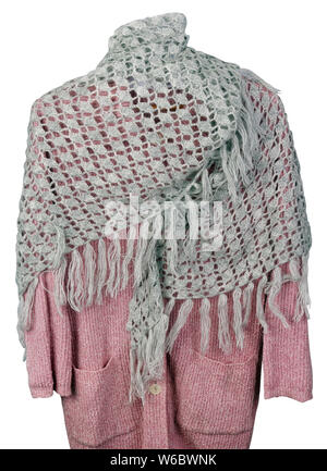 Homemade knitted warm gray triangular soft  women's  scarf hanging on a pink sweater  isolated.  Rustic elderly people style handcraft  concept Stock Photo