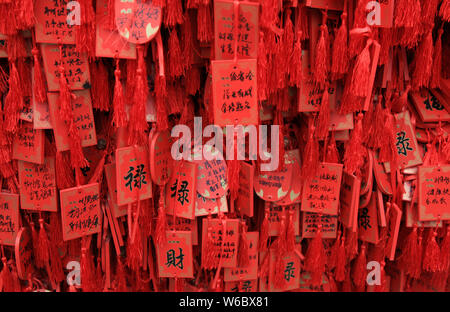 Blessings written by Chinese parents to prayer their children for good luck in the upcoming national college entrance exam, also known as gaokao, are Stock Photo