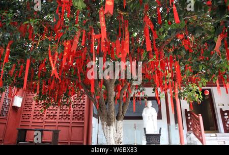 Blessings written by Chinese parents to prayer their children for good luck in the upcoming national college entrance exam, also known as gaokao, are Stock Photo