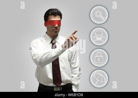 Blindfolded businessman using touch screen Stock Photo - Alamy