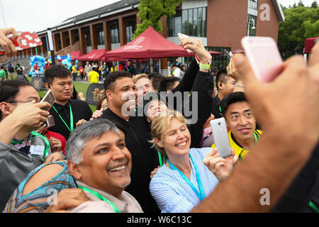 Brazilian football star Ronaldo Luis Nazario de Lima, center, commonly known as Ronaldo, visits one of his soccer schools in Shanghai, China, 20 May 2 Stock Photo