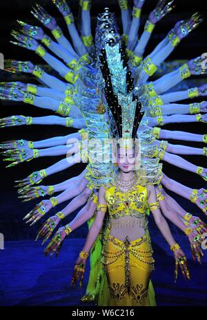 Chinese hearing impaired dancers from China Disabled People's Performing Art Troupe give a charity performance of the Thousand-Hand Guan Yin, the Bodh Stock Photo