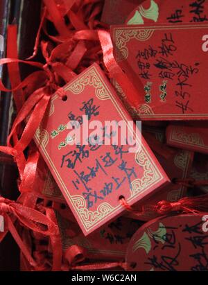 Blessings written by Chinese parents to prayer their children for good luck in the upcoming national college entrance exam, also known as gaokao, are Stock Photo