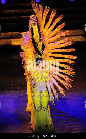 Chinese hearing impaired dancers from China Disabled People's Performing Art Troupe give a charity performance of the Thousand-Hand Guan Yin, the Bodh Stock Photo