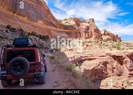 Driving on a narrow dirt road in Canyonlands National Park, Utah Stock Photo