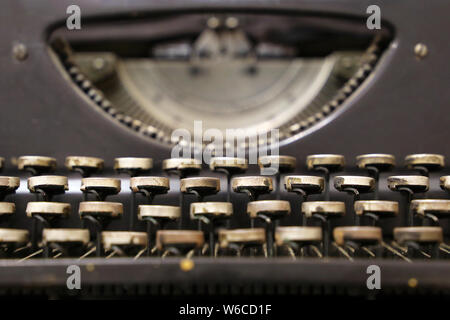 Vintage typewriter keys, selective focus. Old typing technology, retro background Stock Photo