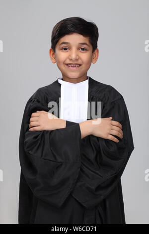 Boy pretending to be a lawyer and smiling Stock Photo