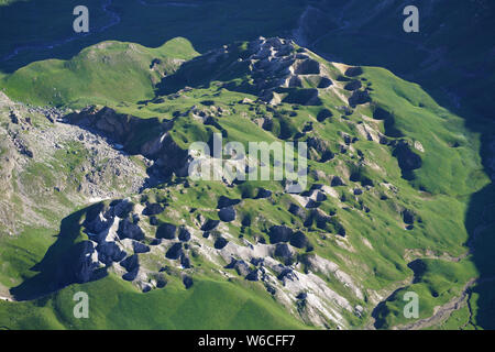 AERIAL VIEW. Large field (length: 750m) of sinkholes (diameter: up to 30m) in a gypsiferous rock. Les Gypsières, Valloire, Savoie, France. Stock Photo