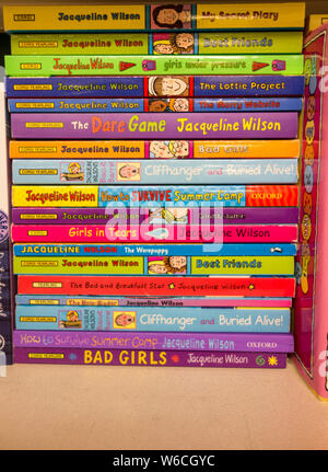 A colorful bookshelf full of Children's Laureate Jacqueline Wilson's books Stock Photo