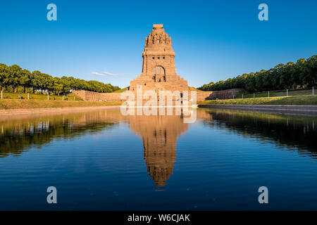 Monument to the Battle of the Nations, the Völkerschlachtdenkmal, mirroring in the water of a big pool Stock Photo