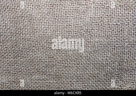 Natural linen texture for the background in beige color. Canvas, burlap. View from above. Stock Photo