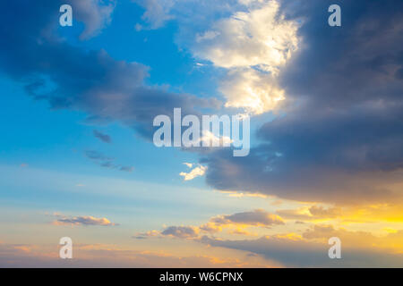 Pink vanilla heaven. Bright blue sky with gentle cumulus clouds. Stock Photo