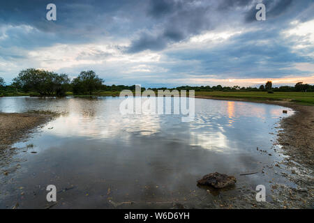 Moody sky over Janesmoor Pond near Fritham in the New Forest National Park in Hampshire Stock Photo