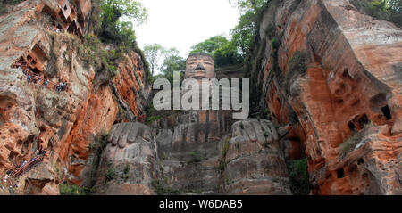 The Leshan Giant Buddha or Leshan Grand Buddha near Chengdu. This is the tallest stone Buddha statue in the world. Leshan Buddha, Sichuan. UNESCO Stock Photo