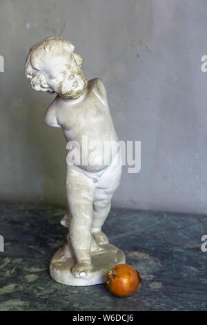 The Cupid statue used as a prop in Paul Cezanne’s painting Still Life With Plaster Cast.  Displayed in the studio of French Post-Impressionist artist Stock Photo