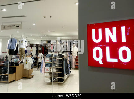 View of anime and manga-themed t-shirts in commemoration with the 50th anniversary of Weekly Shonen Jump for sale at a Uniqlo store in Shanghai, China Stock Photo