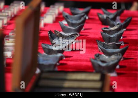 Silver ingots unearthed from the sunken boats owned by peasant leader Zhang Xianzhong (Chang Hsien-chung) of the late Ming dynasty (1368-1644) at the Stock Photo