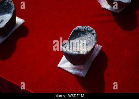 Silver ingots unearthed from the sunken boats owned by peasant leader Zhang Xianzhong (Chang Hsien-chung) of the late Ming dynasty (1368-1644) at the Stock Photo