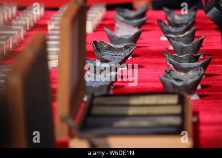 Silver ingots unearthed from the sunken boats owned by peasant leader Zhang Xianzhong (Chang Hsien-chung) of the late Ming dynasty (1368-1644) at the Stock Photo