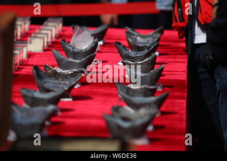 Silver ingots unearthed from the sunken boats owned by peasant leader Zhang Xianzhong (Chang Hsien-chung) of the late Ming dynasty (1368-1644) at the Stock Photo