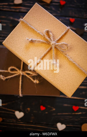 Two brown gift boxes on a wooden background Stock Photo