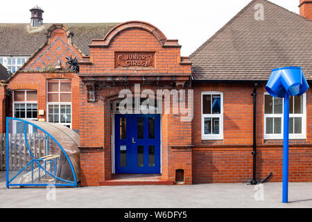 Junior Girls and Order signs on outside wall at Brierly Primary School in Crewe Cheshire UK Stock Photo