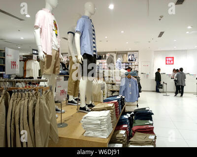 View of anime and manga-themed t-shirts in commemoration with the 50th anniversary of Weekly Shonen Jump for sale at a Uniqlo store in Shanghai, China Stock Photo