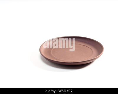 Clay plate on a white background Stock Photo