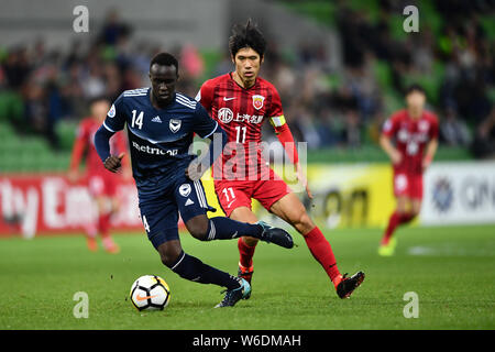 Lv Wenjun of China's Shanghai SIPG FC, right, challenges Thomas Deng of ...