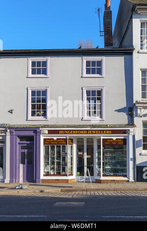 Small local roadside jewellers shop in Hungerford, a historic market town in Berkshire, England on a sunny day with blue sky Stock Photo