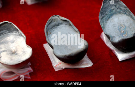 Silver ingots unearthed from the sunken boats owned by peasant leader Zhang Xianzhong (Chang Hsien-chung) of the late Ming dynasty (1368-1644) at the Stock Photo