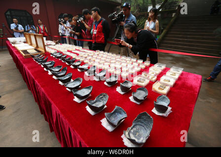 Silver ingots unearthed from the sunken boats owned by peasant leader Zhang Xianzhong (Chang Hsien-chung) of the late Ming dynasty (1368-1644) at the Stock Photo