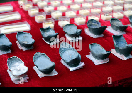 Silver ingots unearthed from the sunken boats owned by peasant leader Zhang Xianzhong (Chang Hsien-chung) of the late Ming dynasty (1368-1644) at the Stock Photo