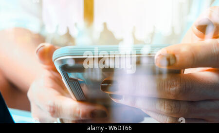 Hands with mobile, double exposure Stock Photo